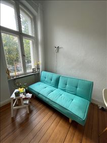 Abbildung: Sofa mit Schlaffunktion in türkis 